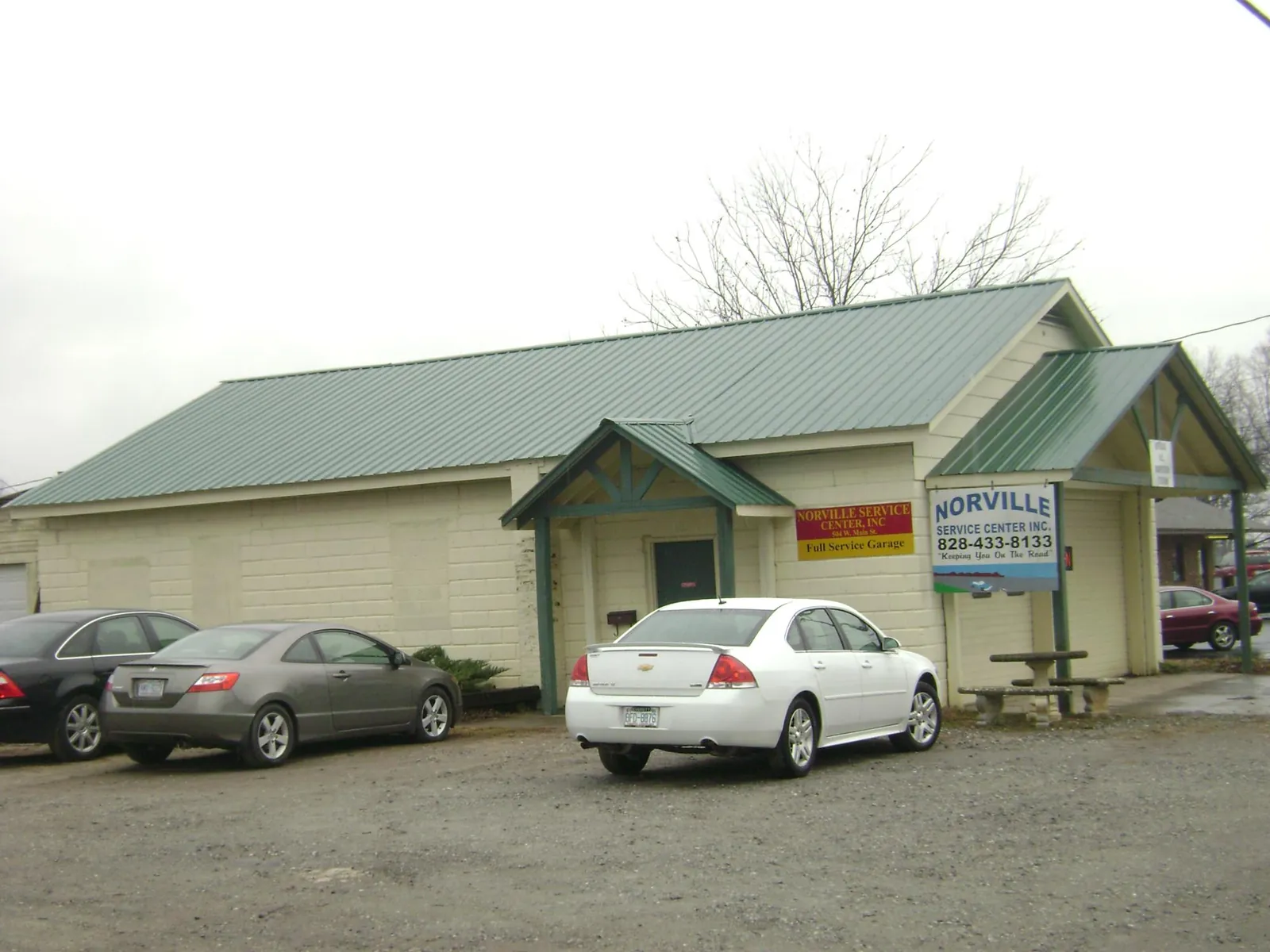 Green metal roof on a service garage with a covered entry in Port Jervis